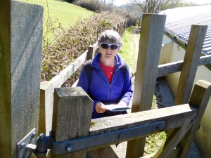 At the kissing gate, turn downhill, passing The Barn at Newmills, to the T-junction.