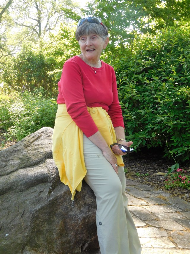 Marty rests on a rock on the Garden.