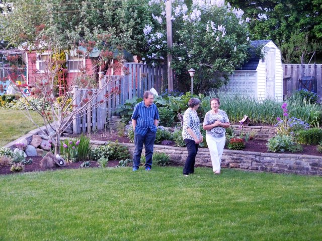 Dean Preheim-Bartel, Marty, and our sister-in-law Vivian, in a May visit, look over her garden at Viv and Brian's home in New Hamburg, Ontario. The garden and yard is an oasis for birds, butterflies, and a not-so-welcome rabbit. 